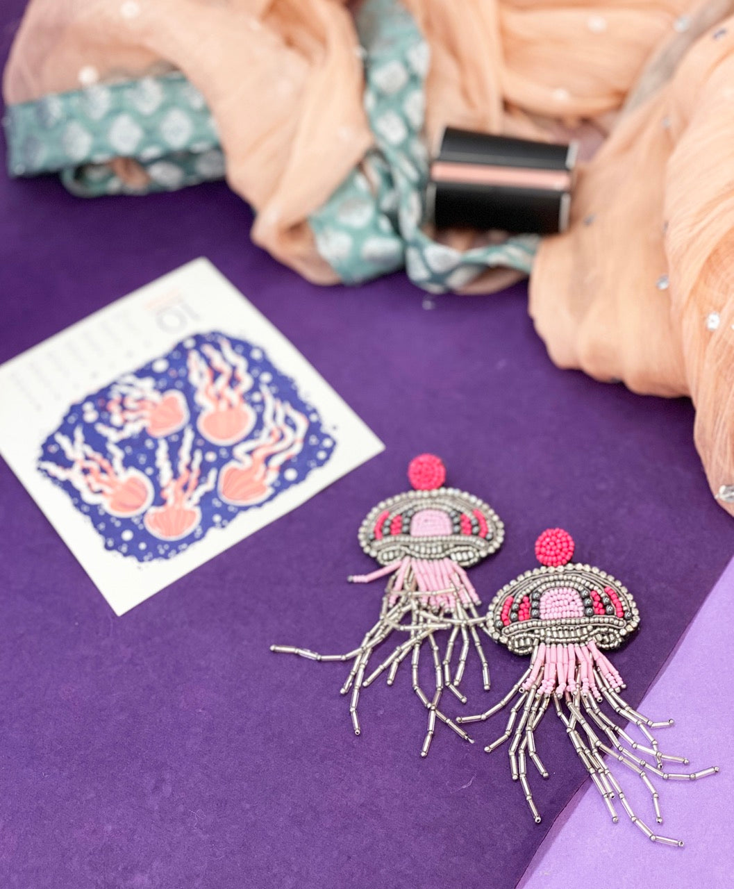 Ocean-inspired Jeweled Jellyfish earrings with "The Future Is Female" design, lightweight and stylish.