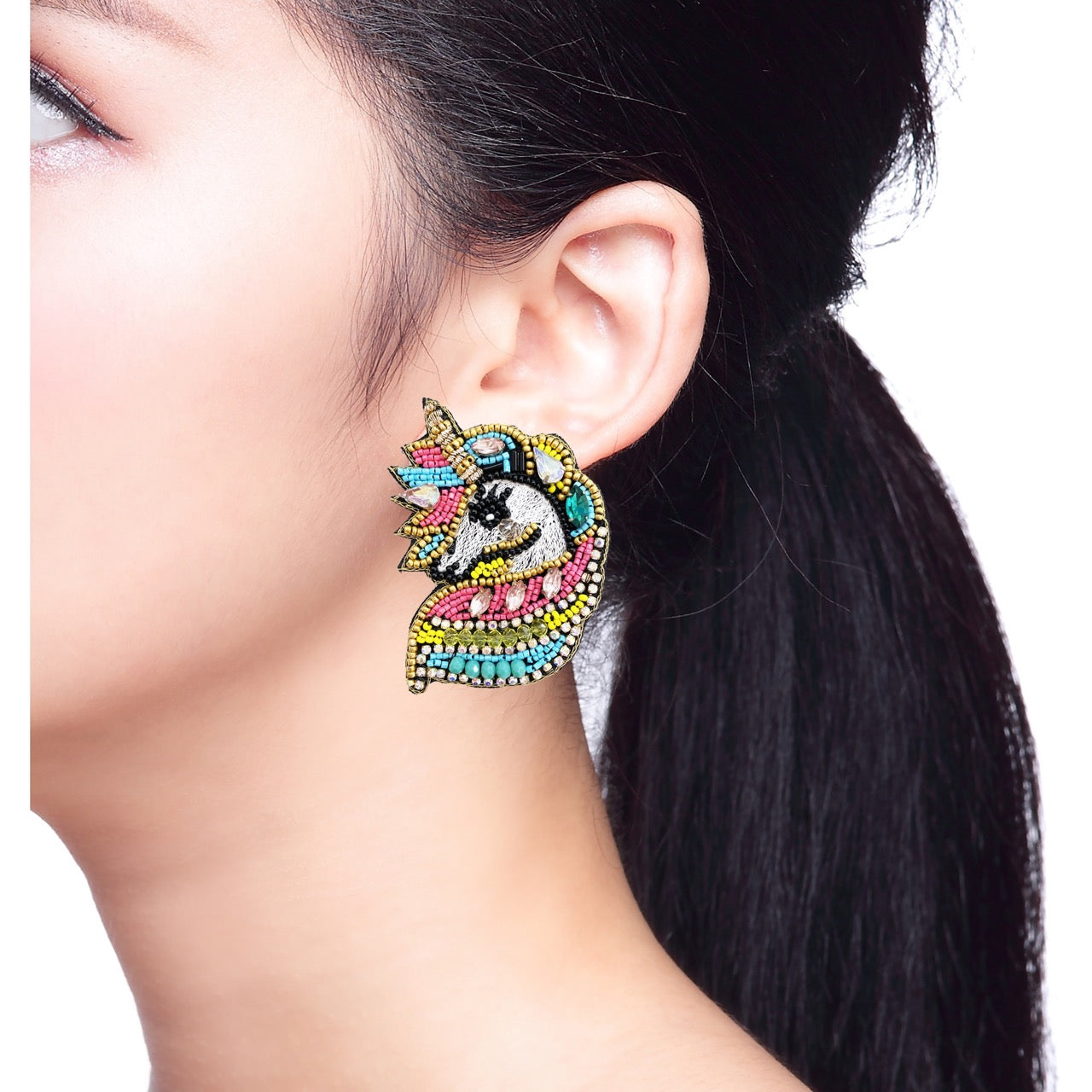 Fun and colorful unicorn earrings with intricate beading and playful accents, perfect for festivals and parties.