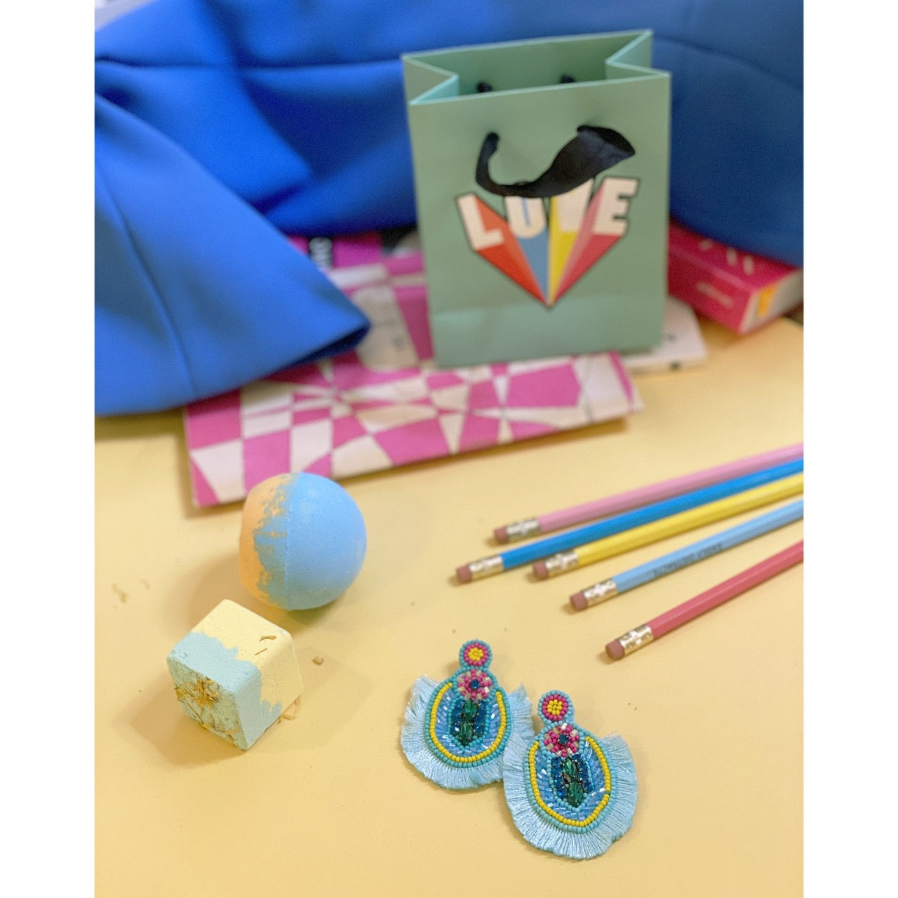 Playful aqua earrings with a beach-ready design, perfect for summer adventures.