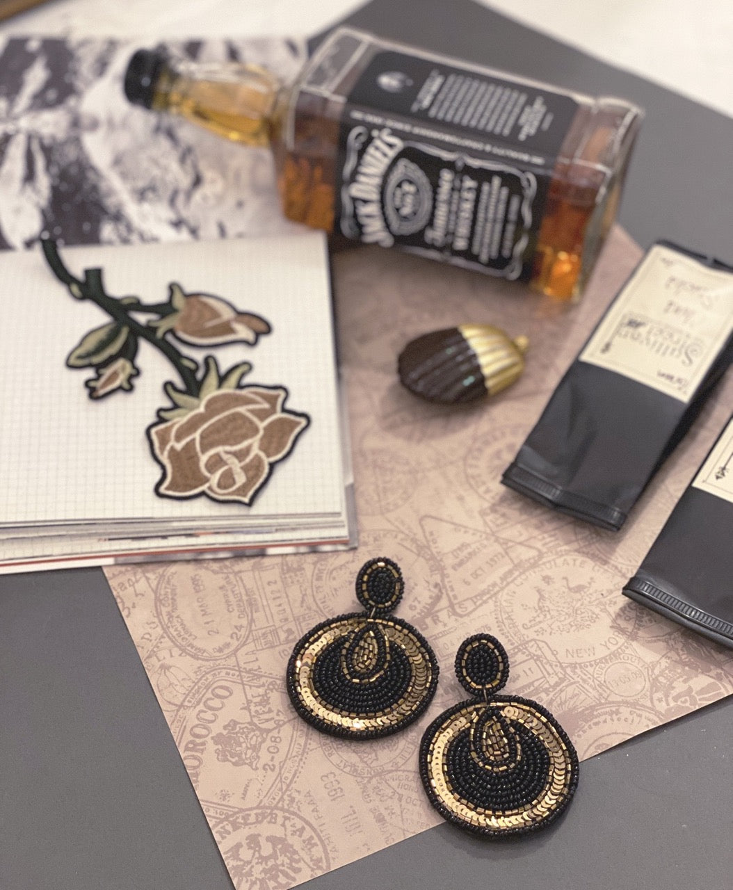 Elegant black and bronze earrings with embroidered beadwork and lightweight statement style