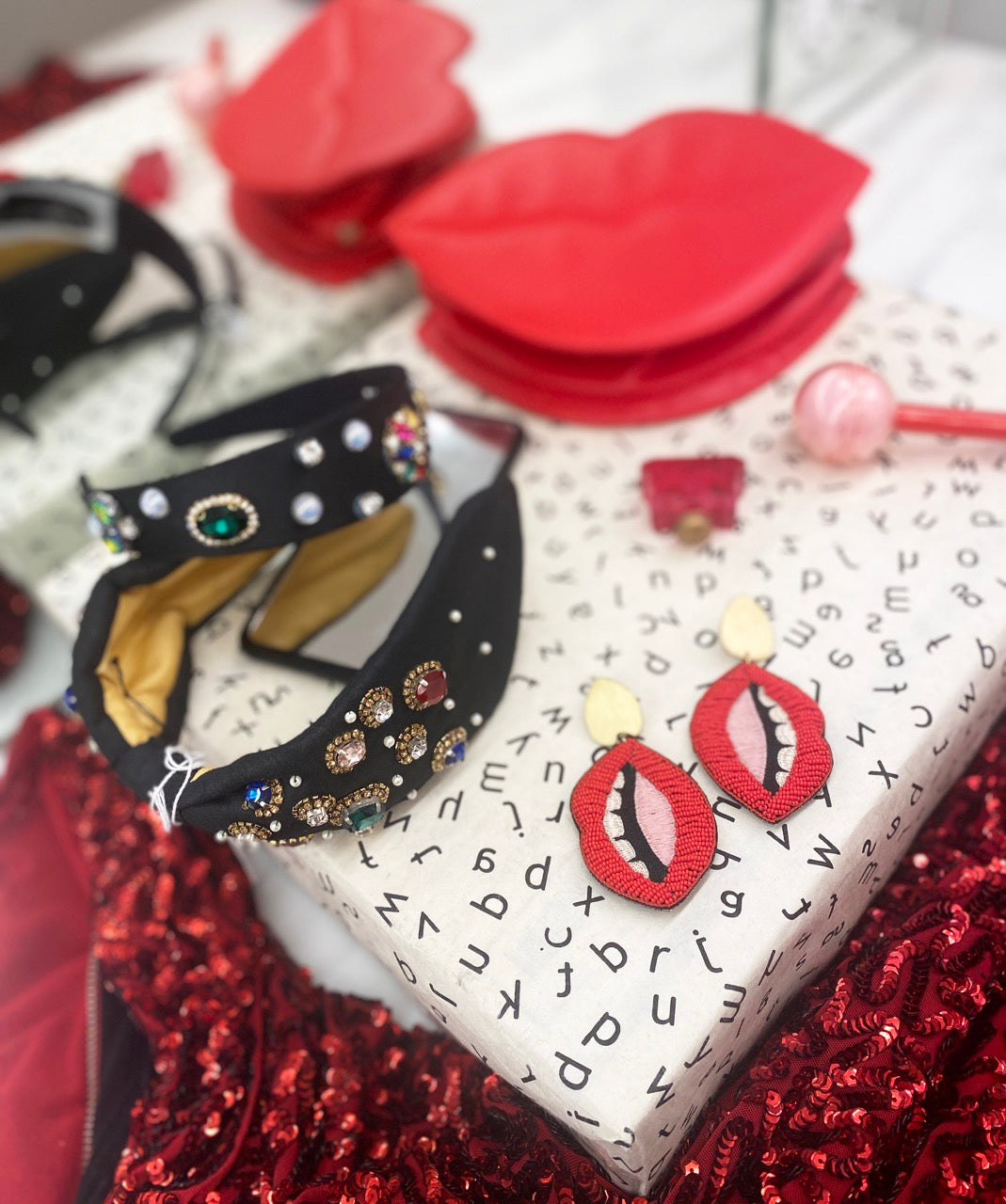 Unique mouth-shaped earrings with a "Love Trumps Hate" message, hypoallergenic and designed for sensitive skin.