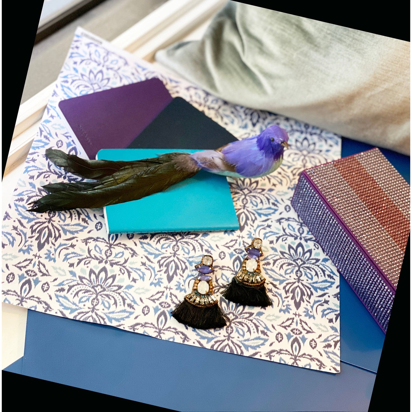 Fringe drop earrings in purple tones with embroidered message patch and gem embellishments