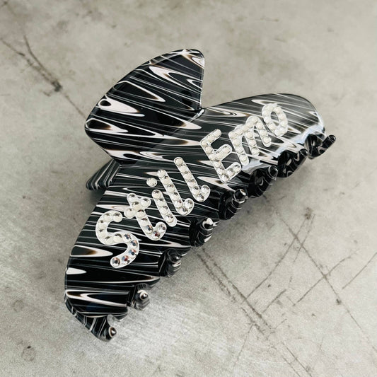 Stylish black and white hair clip with rhinestones