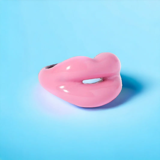 Elegant pewter and pink enamel ring adorned with a radiant solitaire stone, perfect for adding a touch of sparkle to any outfit. Keywords: pewter ring, pink enamel ring, solitaire stone ring
