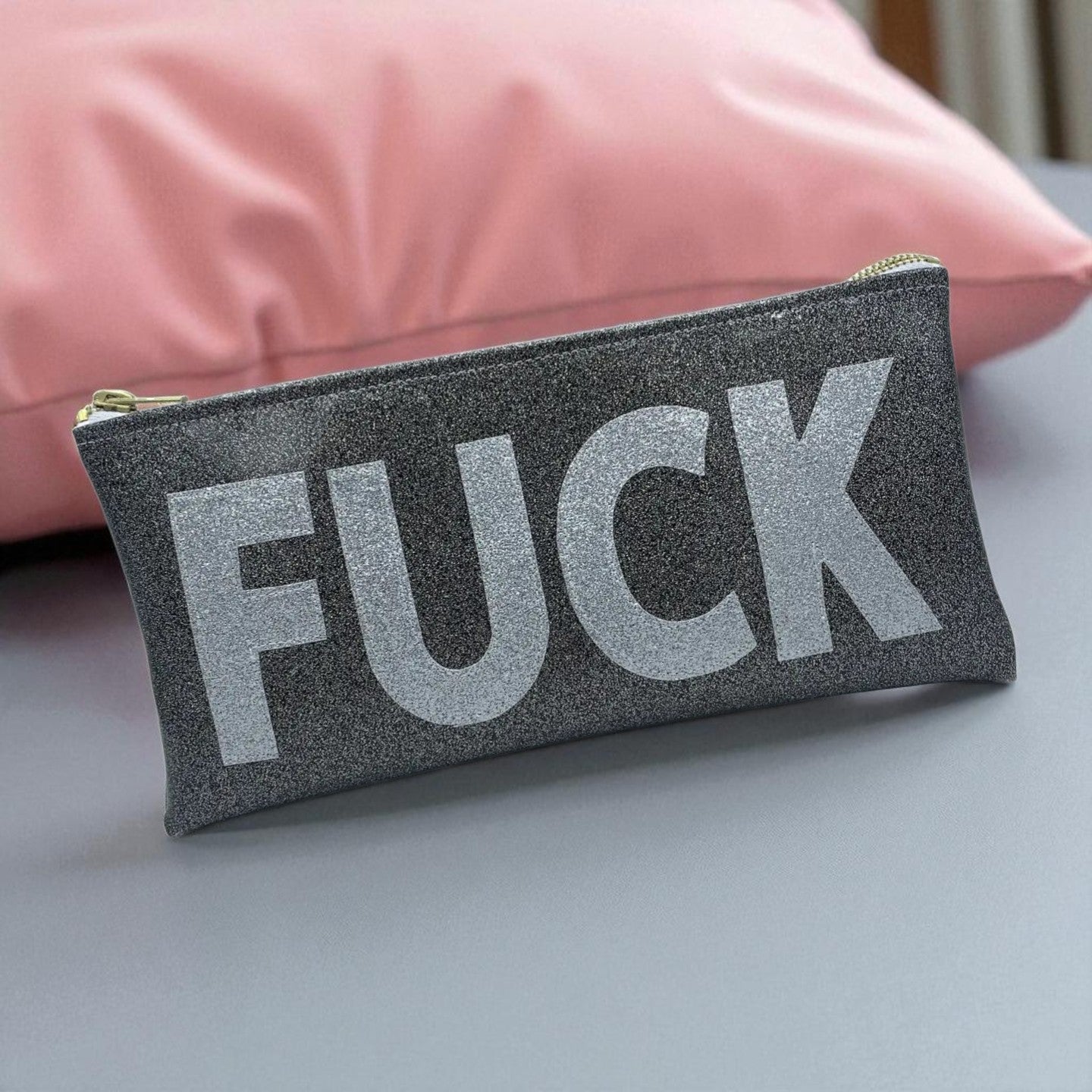 Black glitter pouch with silver graphic design