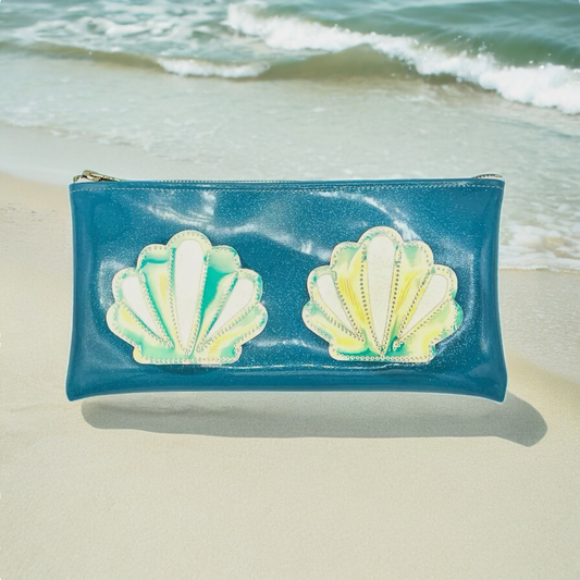 Seashell clutch bag with ocean-inspired design, featuring elegant seashell motifs on a blue background.