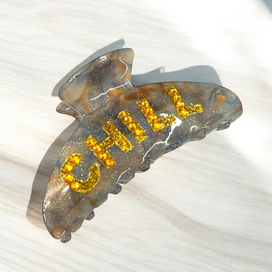 Casual and playful "Chill" hair clip featuring smoky marble and glitter accents, ideal for thick hair.