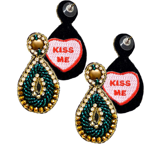 Turquoise teardrop-shaped earrings with hypoallergenic materials and unique "Kiss Me" patch design.