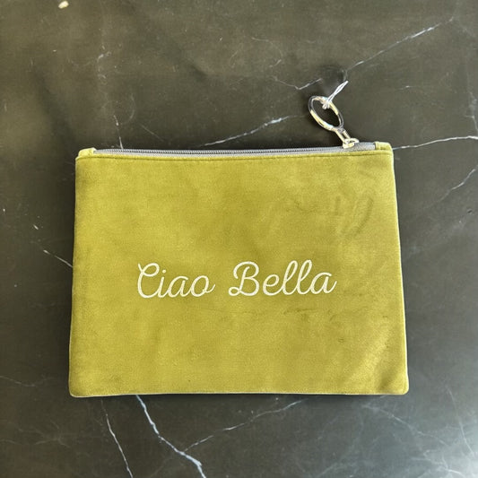 This Ciao Bella suede pouch effortlessly complements any ensemble, adding a touch of sophistication and style. Its compact size makes it ideal for storing essentials like keys, cards, and lipstick, while its soft, luxurious texture adds a hint of elegance.