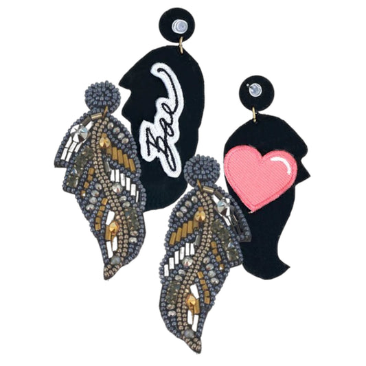 Artistic feather earrings with gold beading and embroidered patches in heart and text designs.