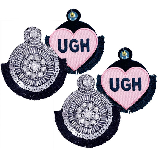 Elegant silver statement earrings with detailed beadwork, black fringe accents, and a unique "UGH" patch design.