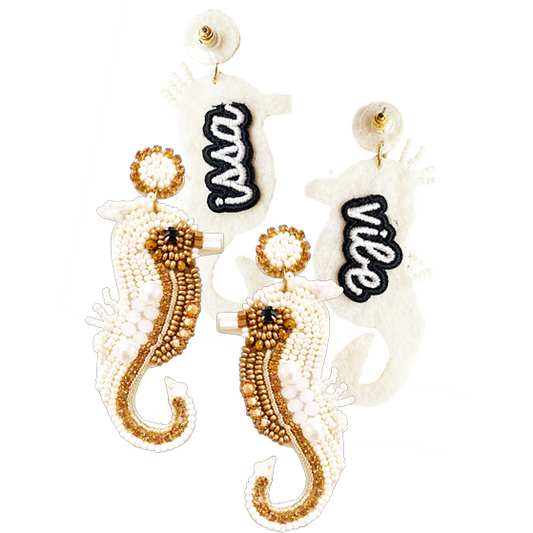 Ivory seahorse earrings with rhinestones and gold beading, perfect for a nautical-themed look.