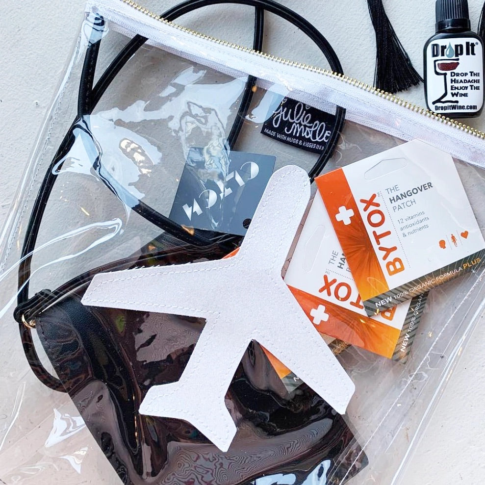 Clear glitter airplane pouch filled with hangover patches and travel must-haves—perfect for your carry-on.