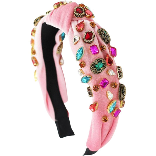 Rainbow Road pink velvet headband with colorful embellishments and a knot design.