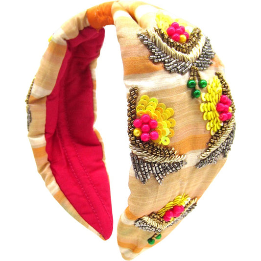 Saffron Sunrise Headband with intricate floral embroidery and beadwork, 2.5” wide, perfect for adding a vibrant touch to any outfit.