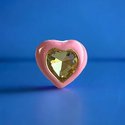 Kawaii pink enamel heart ring with a gold-tone band, ideal for cosplay and anime lovers.