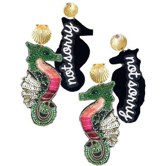 Sassy seahorse earrings with vibrant colors and a "Not Sorry" patch, perfect for making a bold fashion statement.