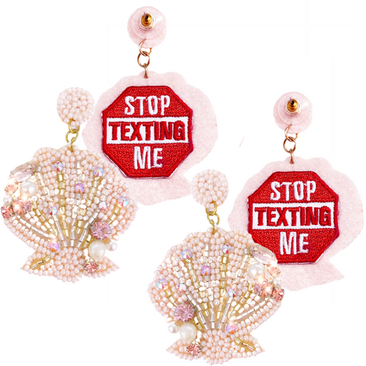 Pink seashell statement earrings with beaded design and bold "Stop Texting Me" patch on back.
