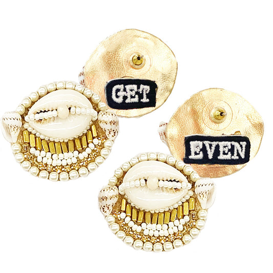 Ivory cowrie shell stud earrings with gold beadwork and "Get Even" patch design, perfect for a stylish summer look.