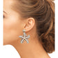Ocean-inspired earrings with a bold starfish design and "Not Sorry" patches, ideal for a statement look.