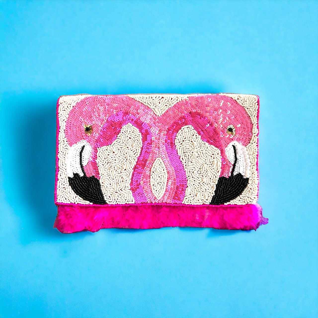Elegant beaded flamingo bag adorned with exquisite pink and white beads, perfect for a stylish summer accessory.
