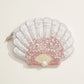 White and blush ombré seashell pouch covered in beads and sequins with a central pearl accent.