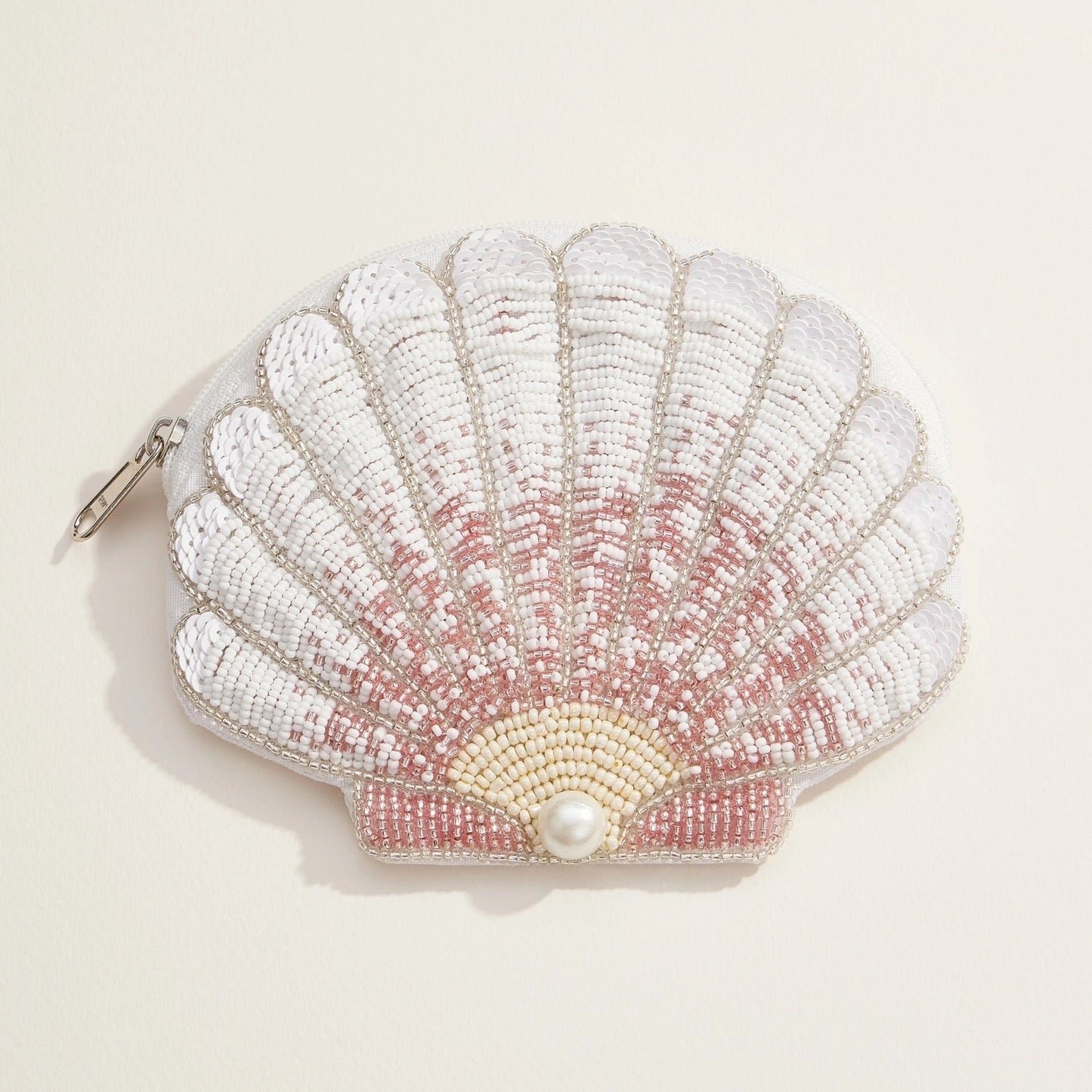 White and blush ombré seashell pouch covered in beads and sequins with a central pearl accent.