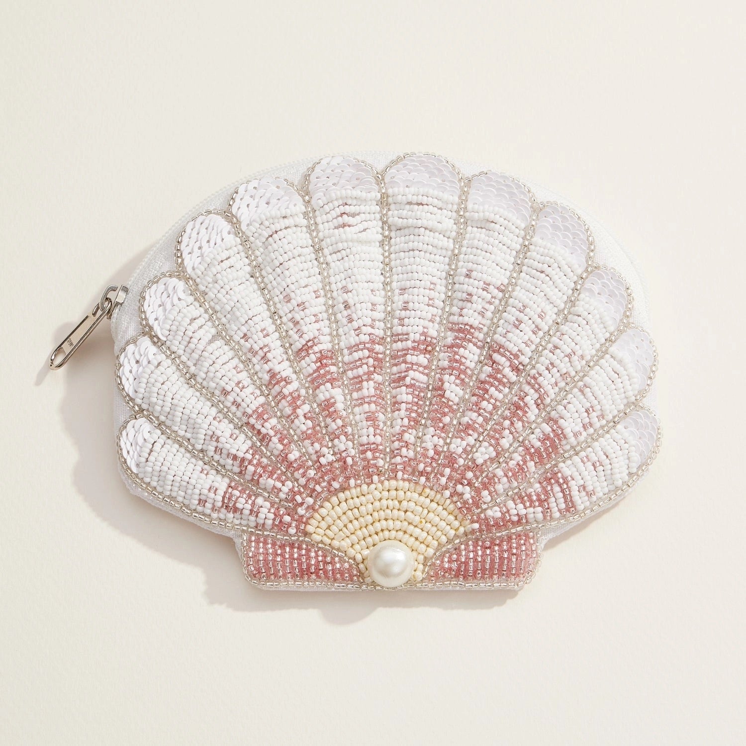 White and blush ombré seashell pouch covered in beads and sequins with a central pearl accent.