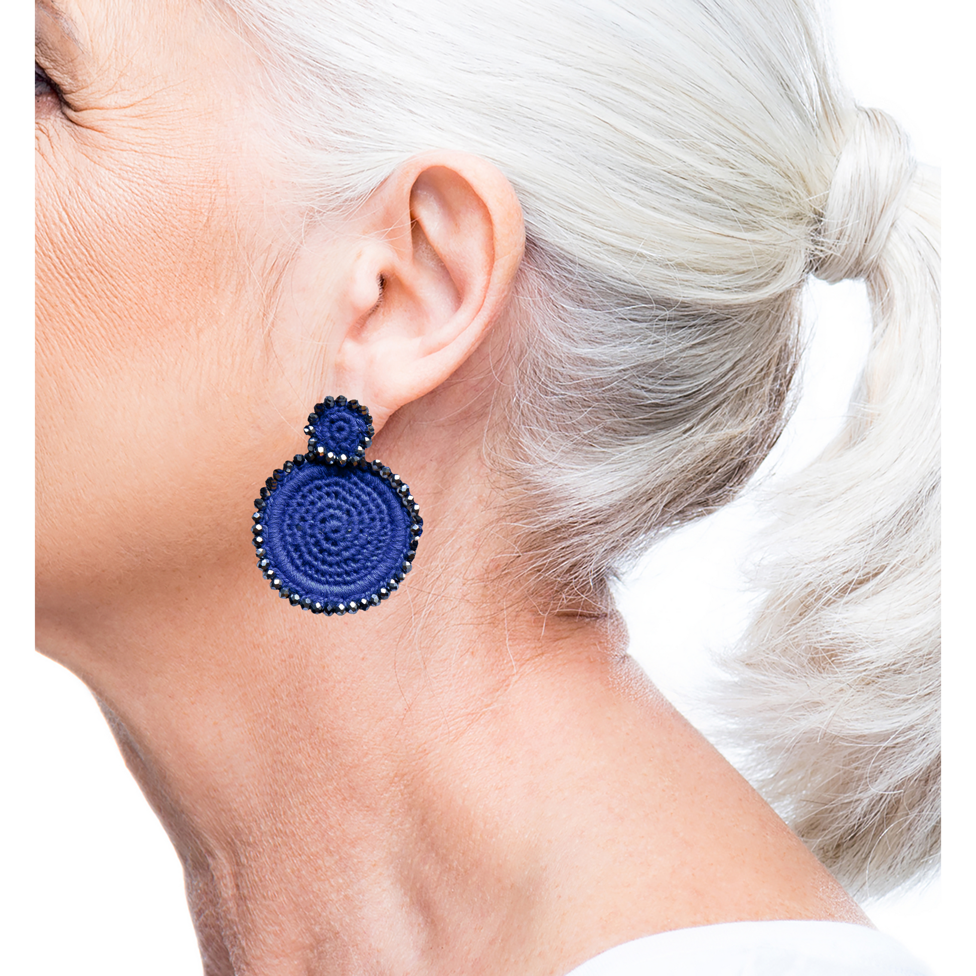 Playful blue earrings with ghost patch and intricate basketweave design, perfect for adding a fun touch to your look.